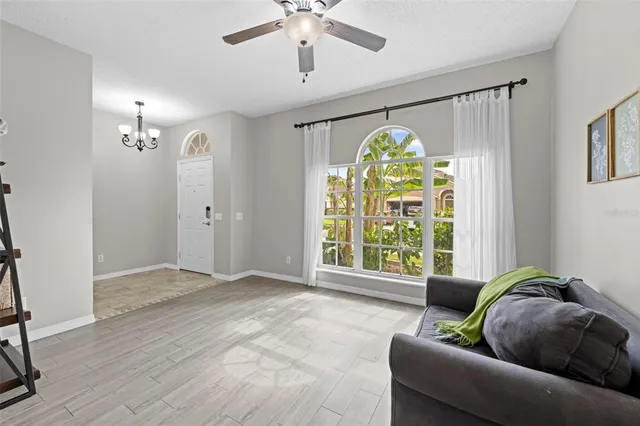 a living room with furniture and a large window
