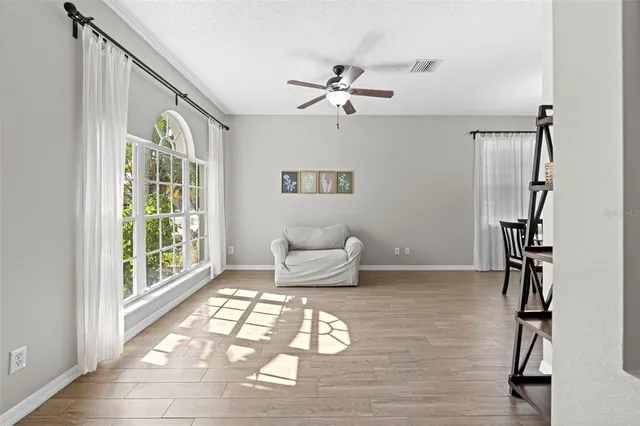 a workspace with furniture and chandelier