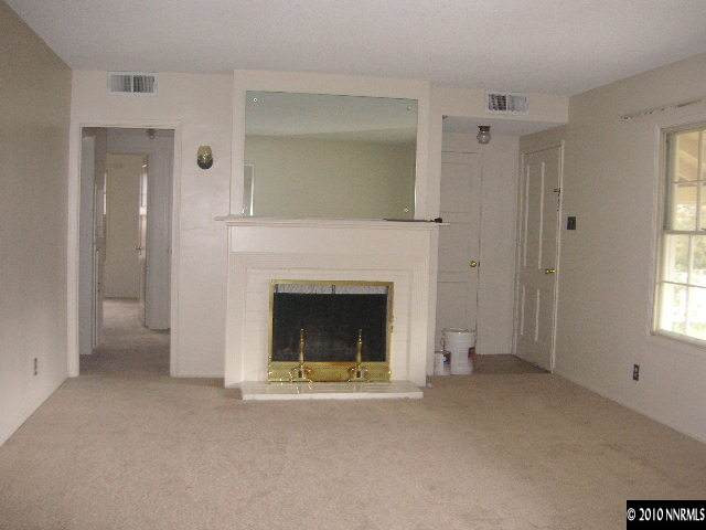 2301 Westfield Avenue Reno, NV 89509 - Photo 2 of 4 a view of a livingroom with a fireplace and window