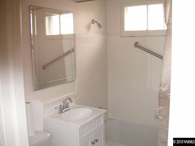 2301 Westfield Avenue Reno, NV 89509 - Photo 4 of 4 a bathroom with a sink and mirror