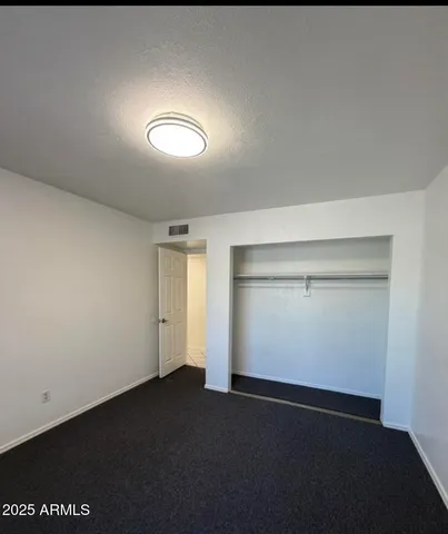 an empty room with a empty space and window