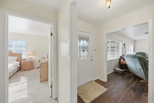 a bedroom with furniture and a window
