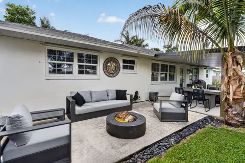 a view of a livingroom with furniture and a patio