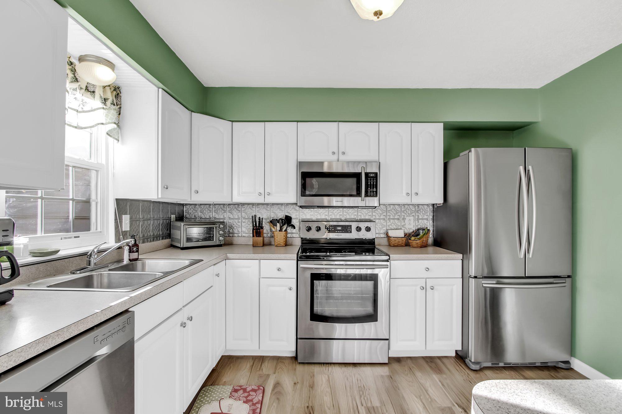 4381 Winchester Road Dover, PA 17315 - Photo 12 of 26 laminate floors in the eat in kitchen