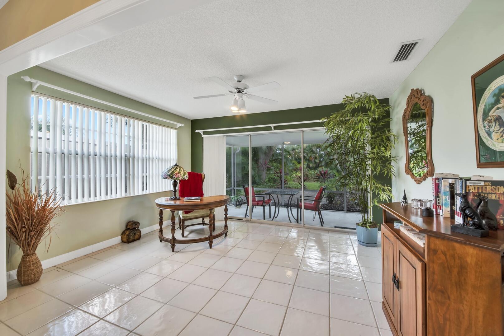 4220 Royal Oak Drive Palm Beach Gardens, FL 33410 - Photo 12 of 35 a living room with furniture and a large window