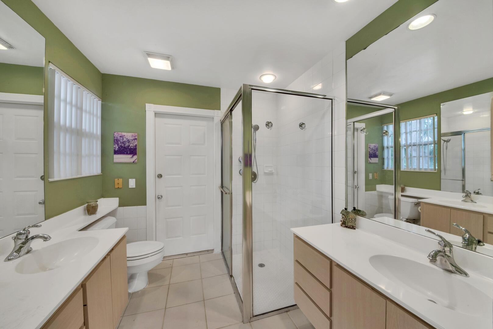 4220 Royal Oak Drive Palm Beach Gardens, FL 33410 - Photo 14 of 35 a bathroom with a sink a toilet and shower