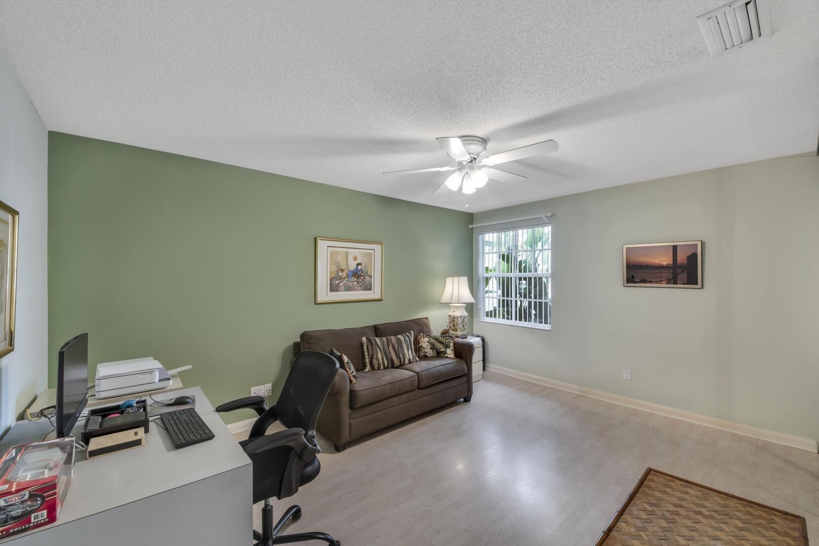 4220 Royal Oak Drive Palm Beach Gardens, FL 33410 - Photo 15 of 35 a living room with furniture and a window