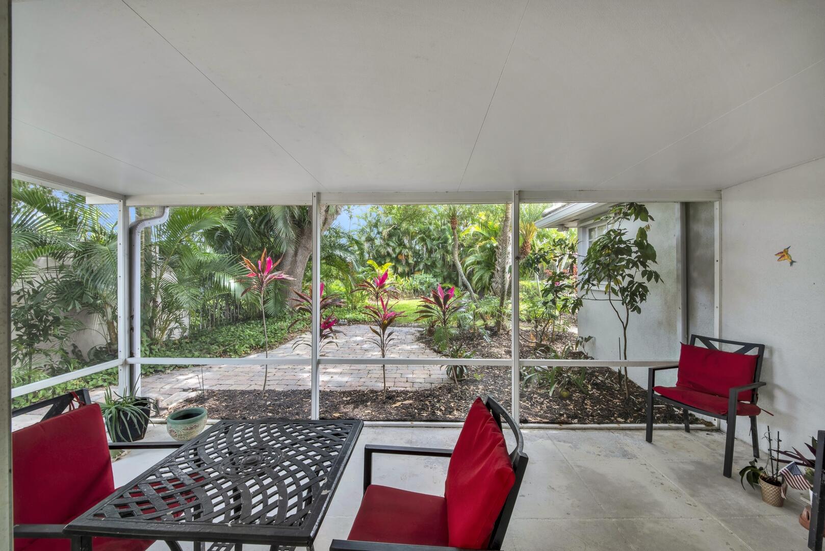 4220 Royal Oak Drive Palm Beach Gardens, FL 33410 - Photo 17 of 35 a outdoor space with lots of furniture and a potted plant