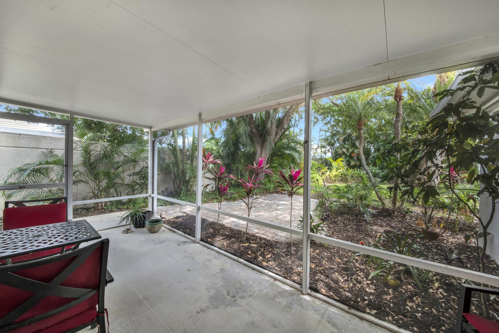 4220 Royal Oak Drive Palm Beach Gardens, FL 33410 - Photo 18 of 35 a room with lots of trees and flowers