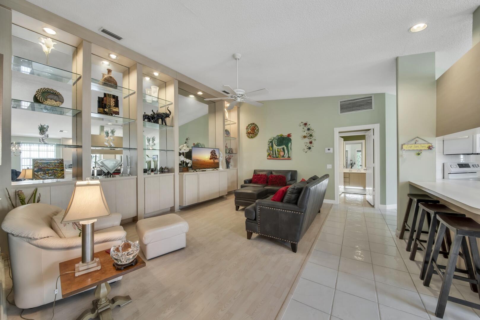 4220 Royal Oak Drive Palm Beach Gardens, FL 33410 - Photo 2 of 35 a living room with furniture and a wooden floor