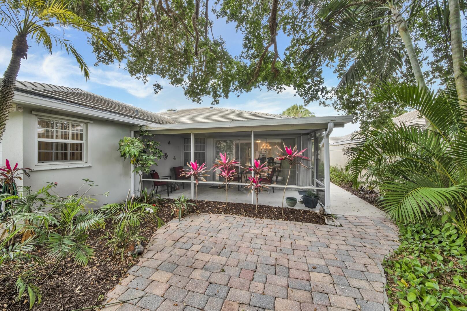 4220 Royal Oak Drive Palm Beach Gardens, FL 33410 - Photo 21 of 35 a view of an chairs and table in the patio