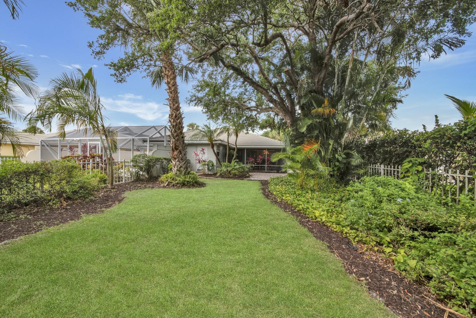 4220 Royal Oak Drive Palm Beach Gardens, FL 33410 - Photo 23 of 35 a view of a garden with a fountain