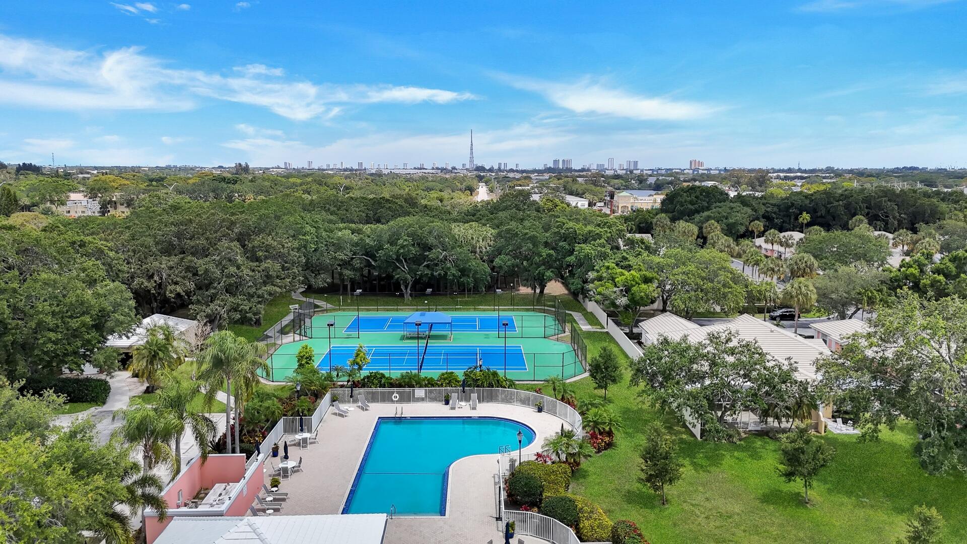 4220 Royal Oak Drive Palm Beach Gardens, FL 33410 - Photo 33 of 35 an aerial view of house with yard swimming pool and outdoor seating