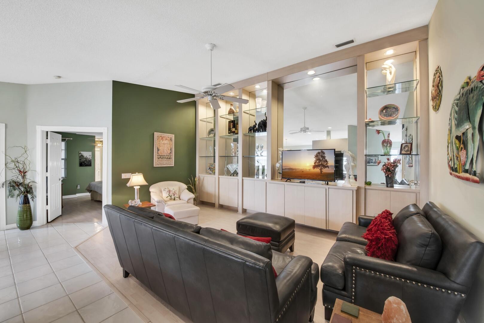 4220 Royal Oak Drive Palm Beach Gardens, FL 33410 - Photo 4 of 35 a living room with furniture and a large window