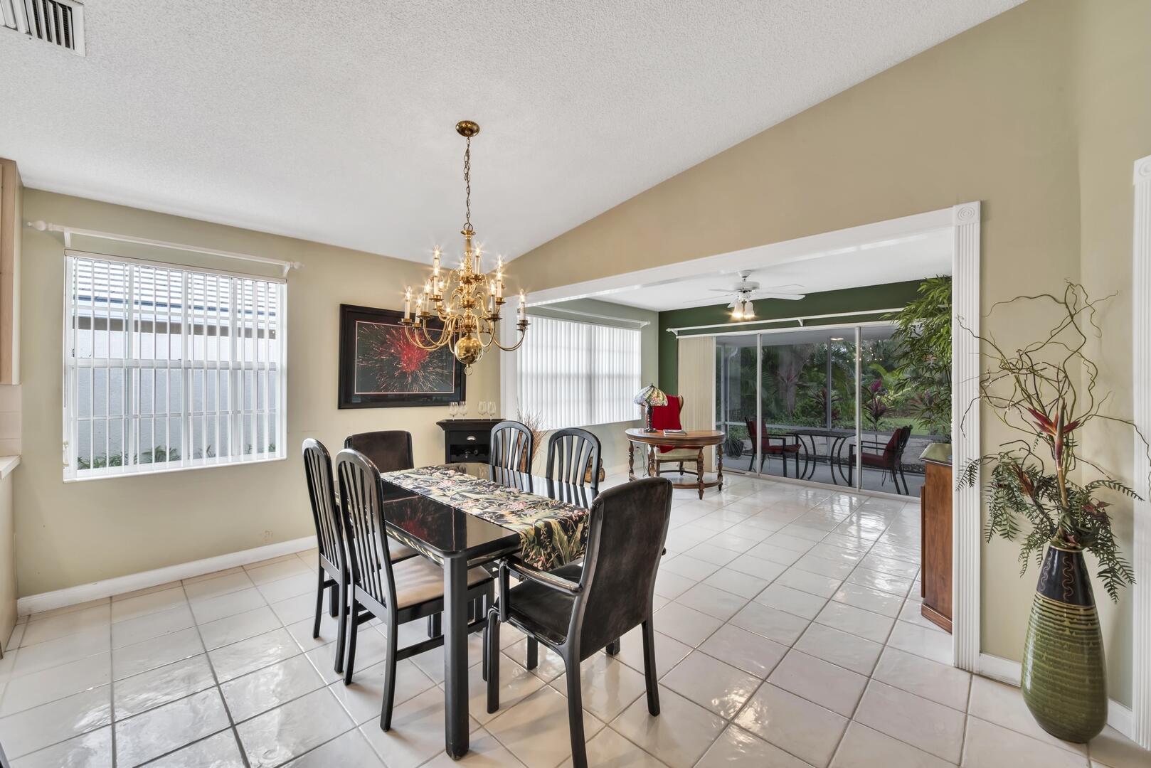 4220 Royal Oak Drive Palm Beach Gardens, FL 33410 - Photo 9 of 35 a view of a dining room with furniture and window