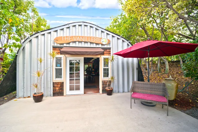 a front view of house with an umbrella