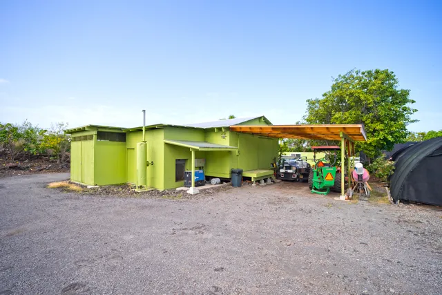 a view of a chairs and table in a patio