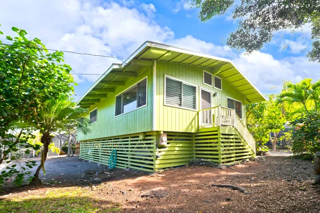 an aerial view of a house with a garden