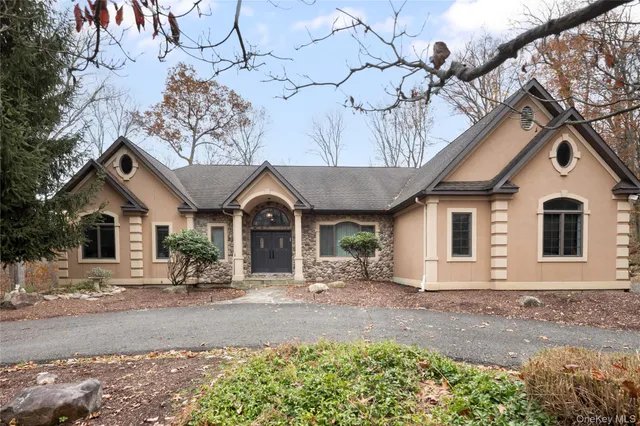 front view of a house with a yard