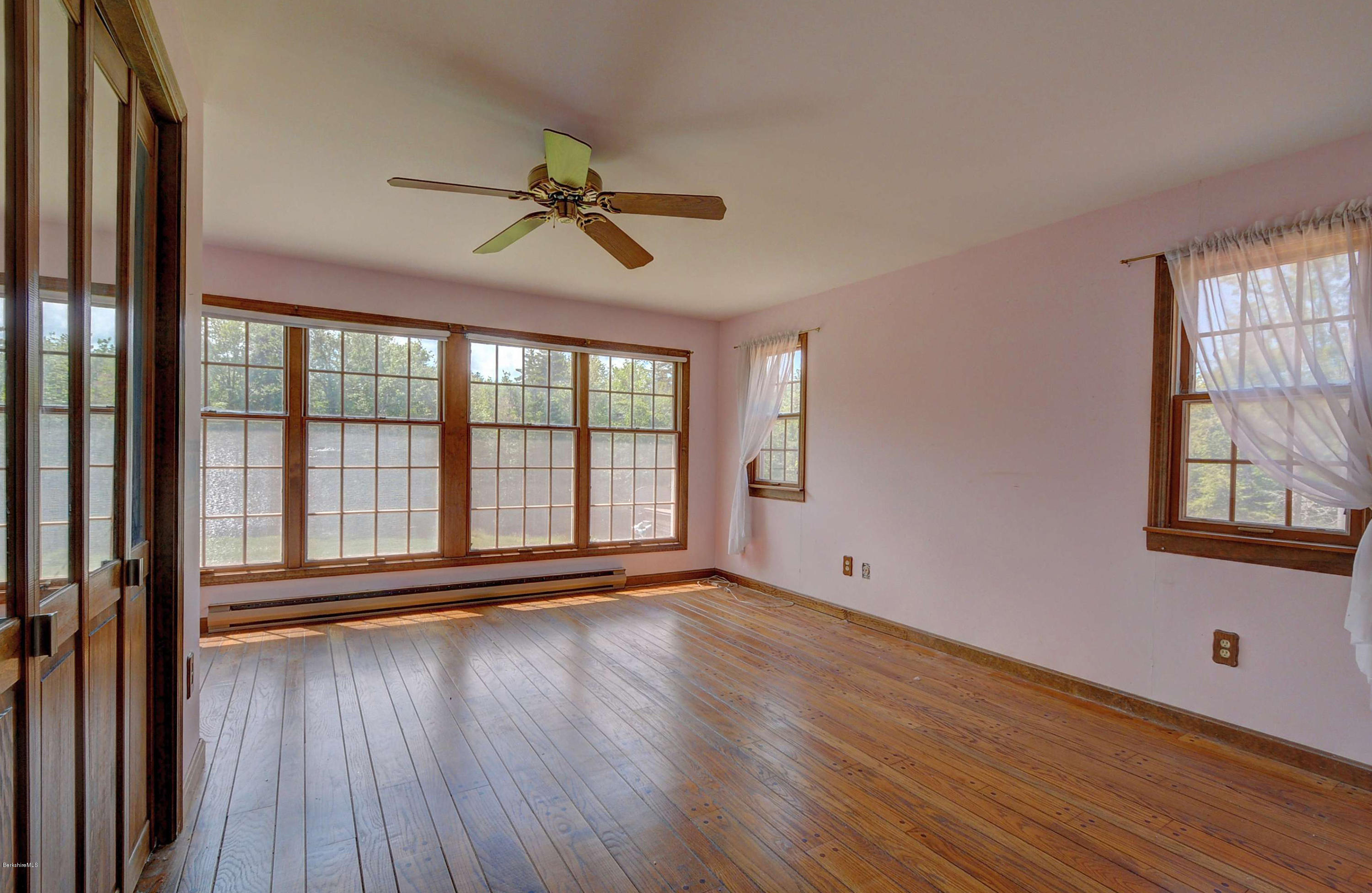 11 Andes Road Peru, MA 01235 - Photo 23 of 29 a view of empty room with wooden floor and fan