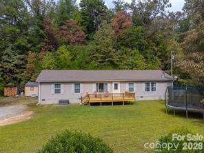 179 Fresh Water Rdg Road Whittier, NC 28789 - Photo 4 of 48 a front view of a house with a garden and trees