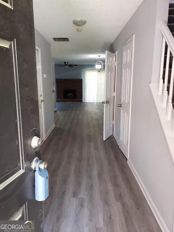 a view of an empty room and fire place