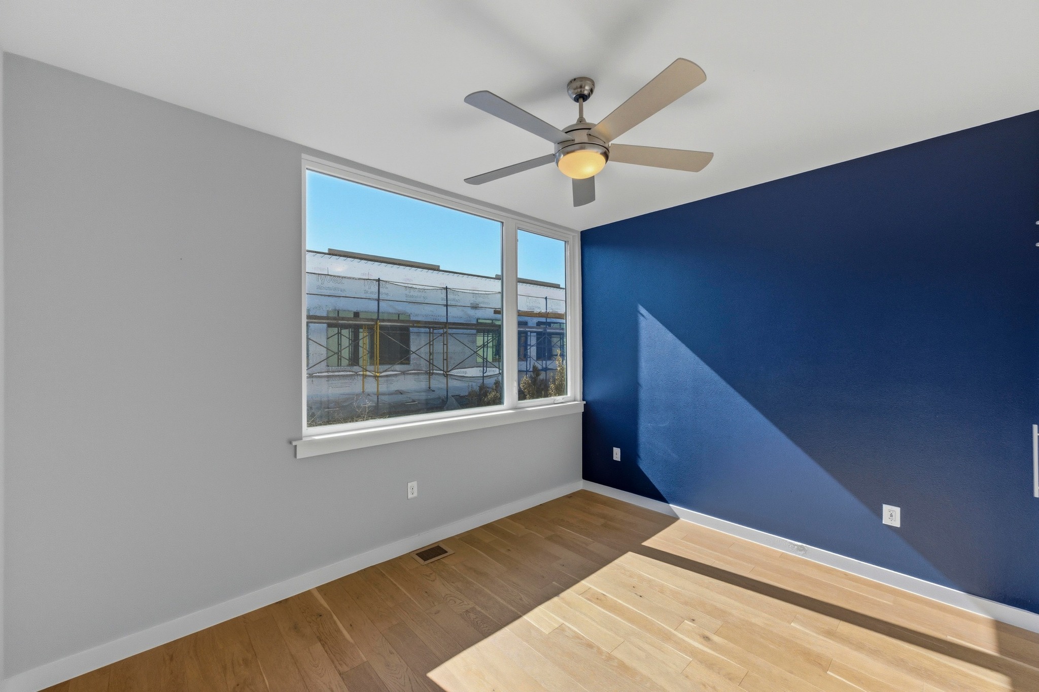 2002 East 7th Street, Unit 242 Austin, TX 78702 - Photo 15 of 34 Spare room featuring wood finished floors and a ceiling fan