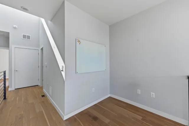 a view of a hallway with staircase