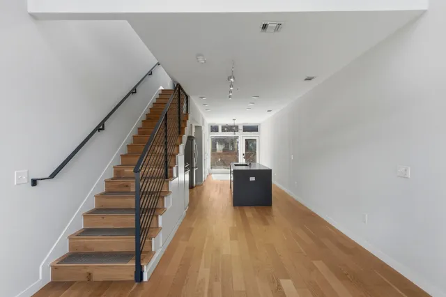 a view of entryway with wooden floor