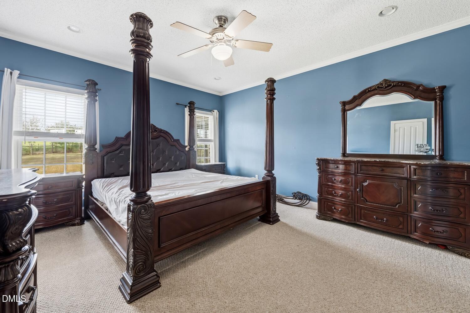 2890 Rosser Road Bear Creek, NC 27207 - Photo 5 of 6 a bedroom with a bed and a dresser