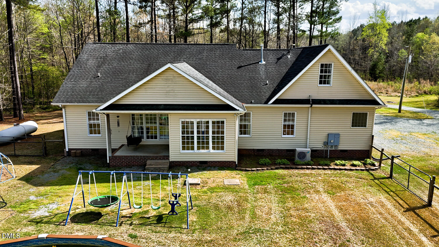2890 Rosser Road Bear Creek, NC 27207 - Photo 6 of 6 a front view of a house with a yard table and chairs