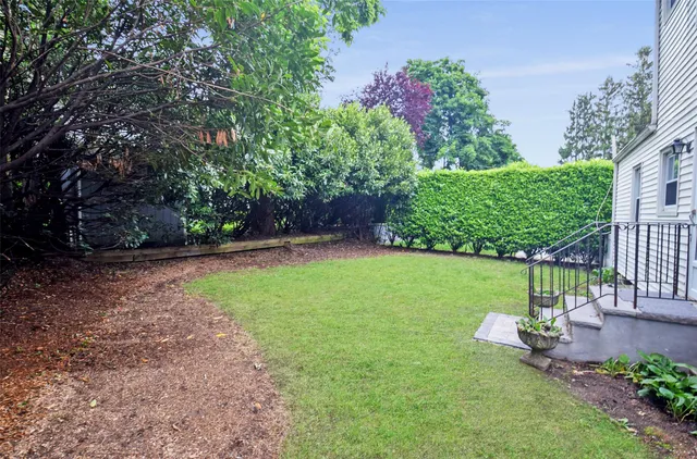 a view of a backyard with garden