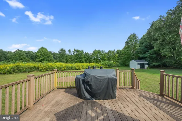 a view of a deck with mountain view and a lake view