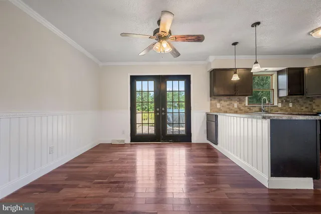 a view of a kitchen with a sink and a window