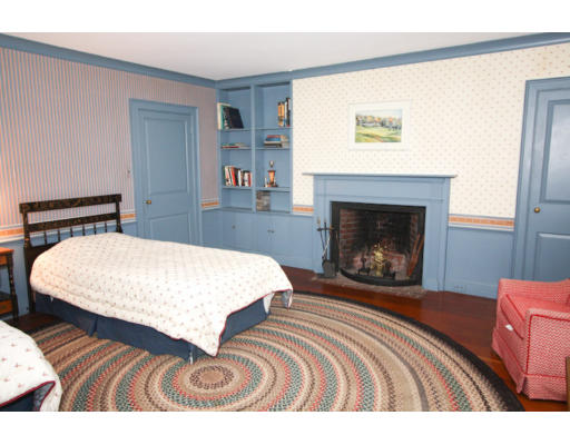 14 Sunset Rock Road Andover, MA 01810 - Photo 12 of 26 a bedroom with a bed and a fireplace