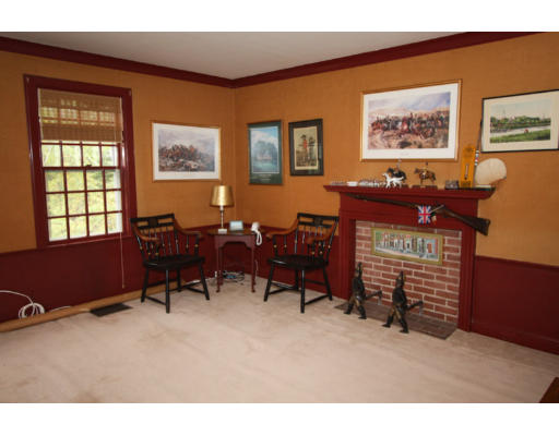 14 Sunset Rock Road Andover, MA 01810 - Photo 17 of 26 a living room with furniture a piano and a fireplace
