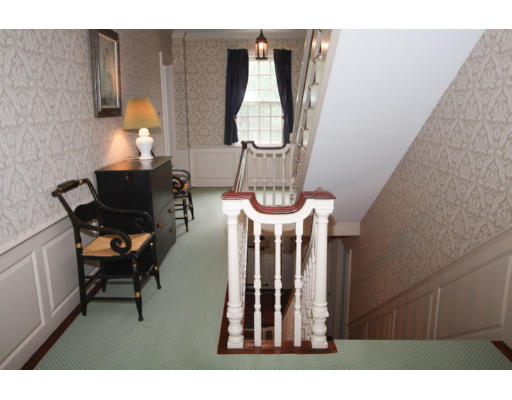 14 Sunset Rock Road Andover, MA 01810 - Photo 20 of 26 a living room with furniture and a chandelier