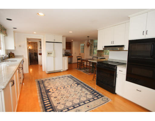 14 Sunset Rock Road Andover, MA 01810 - Photo 5 of 26 a kitchen with stainless steel appliances granite countertop a sink stove and refrigerator