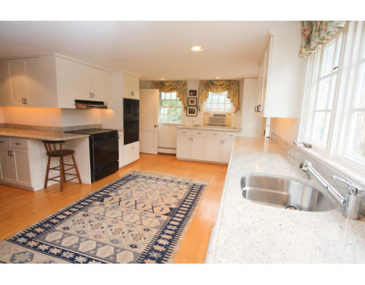 14 Sunset Rock Road Andover, MA 01810 - Photo 6 of 26 a kitchen with stainless steel appliances granite countertop a sink stove and granite counter tops