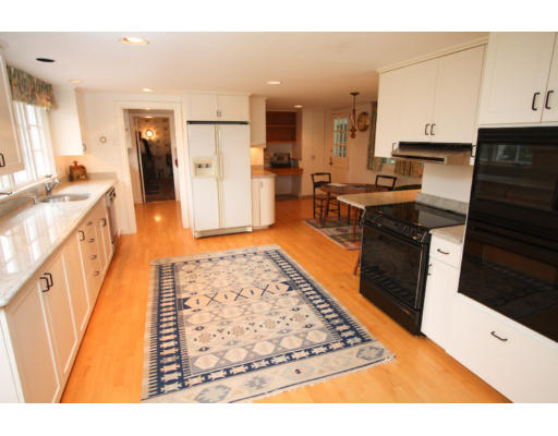 14 Sunset Rock Road Andover, MA 01810 - Photo 7 of 26 a kitchen with stainless steel appliances granite countertop a refrigerator stove oven and white cabinets