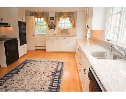 14 Sunset Rock Road Andover, MA 01810 - Photo 8 of 26 a kitchen with granite countertop a sink and a stove top oven