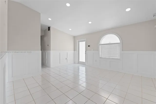 a view of an empty room and window