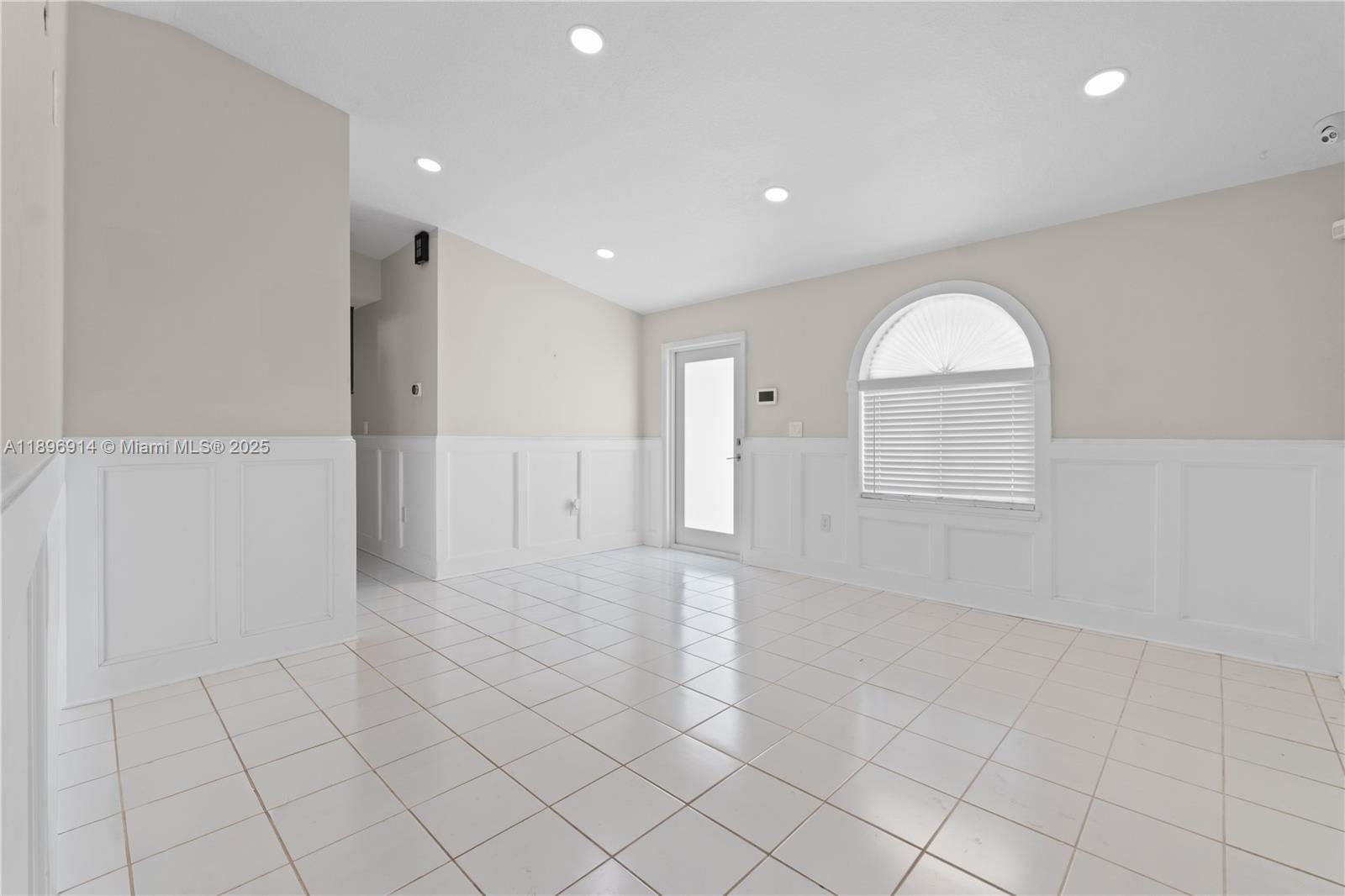 a view of an empty room and window