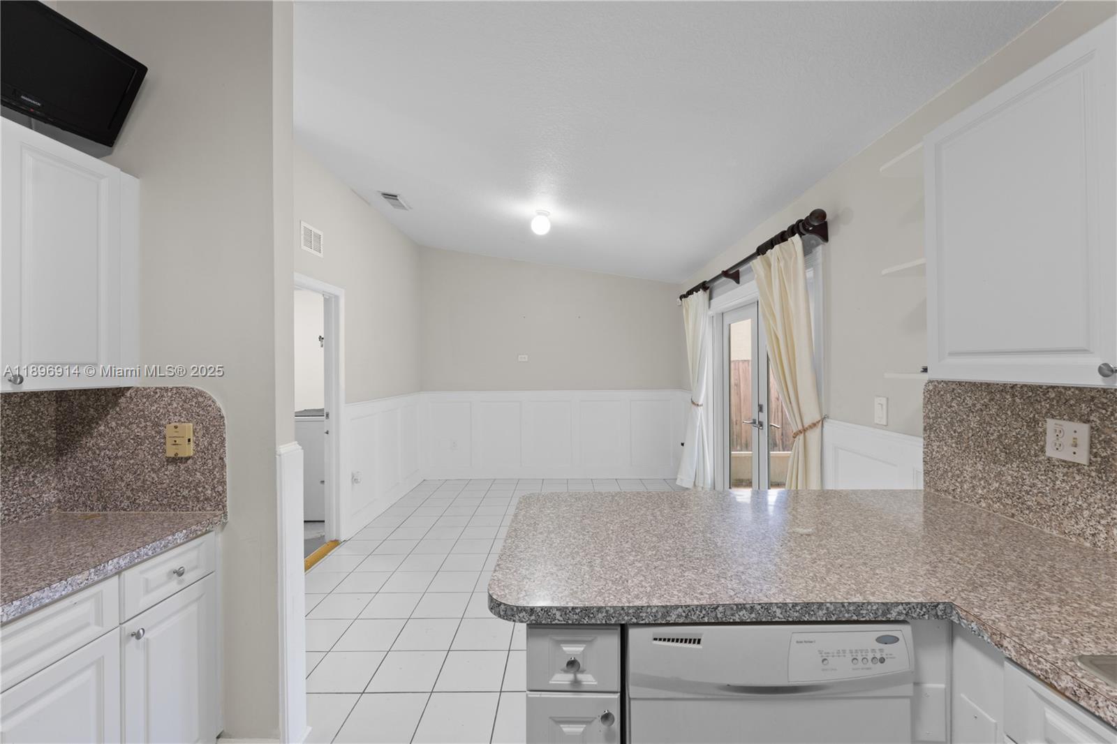 15327 Southwest 179th Terrace Miami, FL 33187 - Photo 11 of 29 a kitchen with granite countertop a sink and a stove with granite countertops
