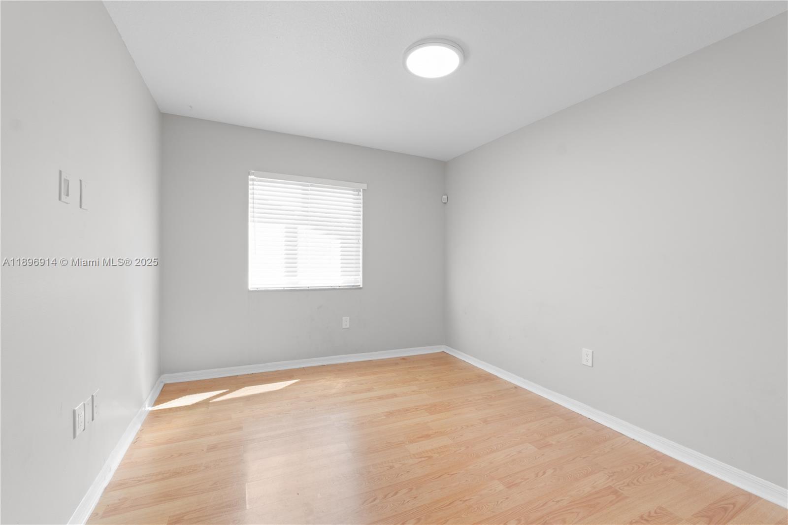 15327 Southwest 179th Terrace Miami, FL 33187 - Photo 13 of 29 an empty room with a window