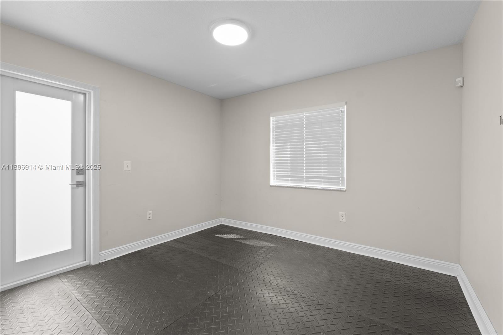 15327 Southwest 179th Terrace Miami, FL 33187 - Photo 16 of 29 an empty room with a window