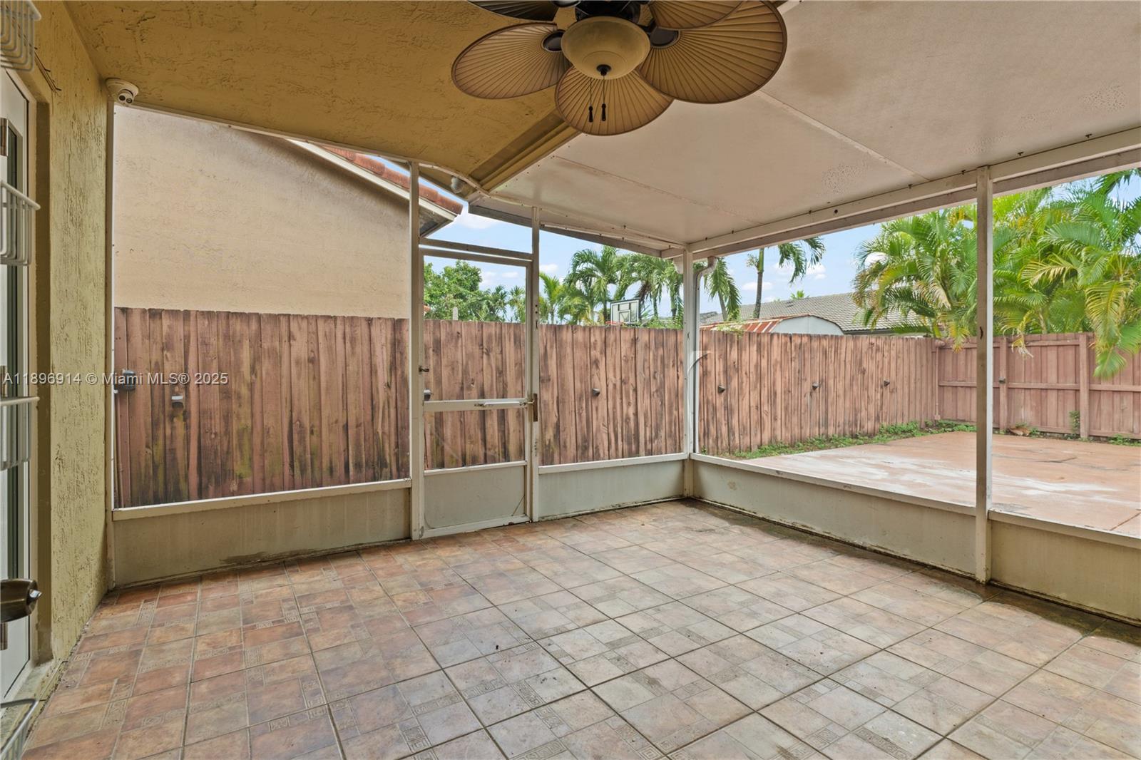 15327 Southwest 179th Terrace Miami, FL 33187 - Photo 21 of 29 a view of backyard with a tub and wooden fence