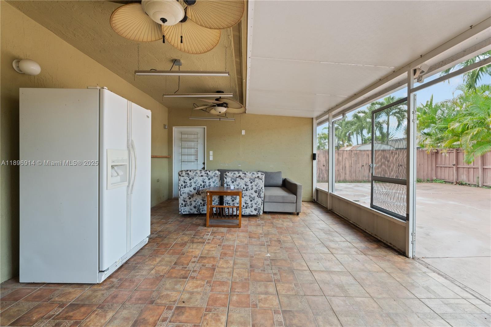 15327 Southwest 179th Terrace Miami, FL 33187 - Photo 23 of 29 a spacious bedroom with a bed and large windows