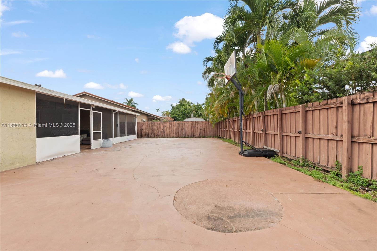 15327 Southwest 179th Terrace Miami, FL 33187 - Photo 25 of 29 a view of a house with backyard and sitting area