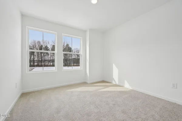 a view of a small space with wooden floor